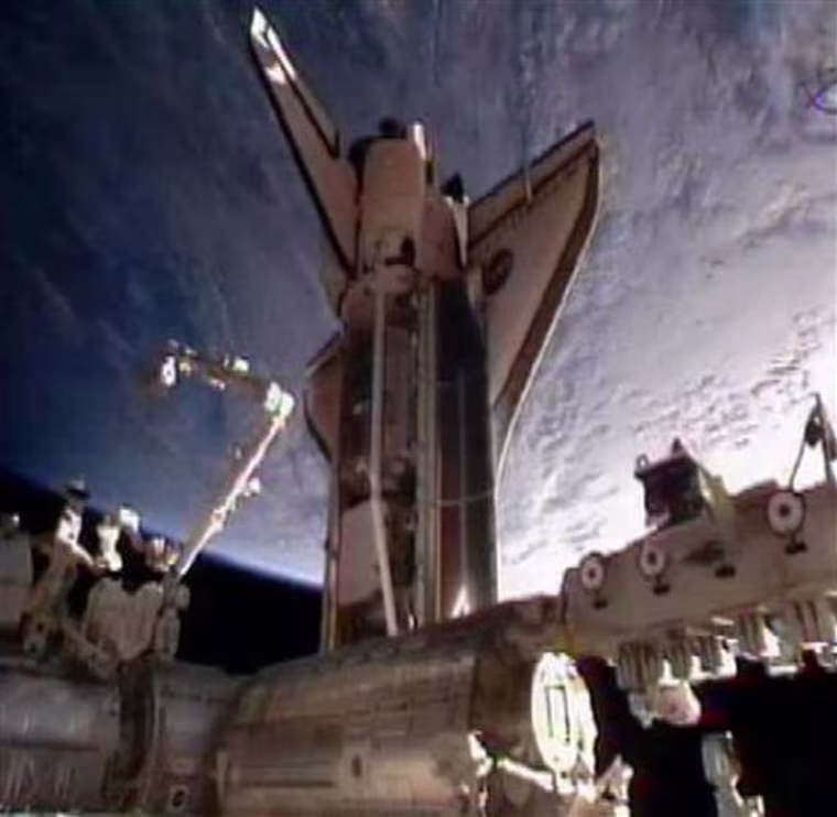 In this frame grab from video taken from NASA television, space shuttle Discovery is seen moments after docking at the International Space Station, its final visit before being parked at a museum, Saturday, Feb. 26, 2011. (AP Photo/NASA)